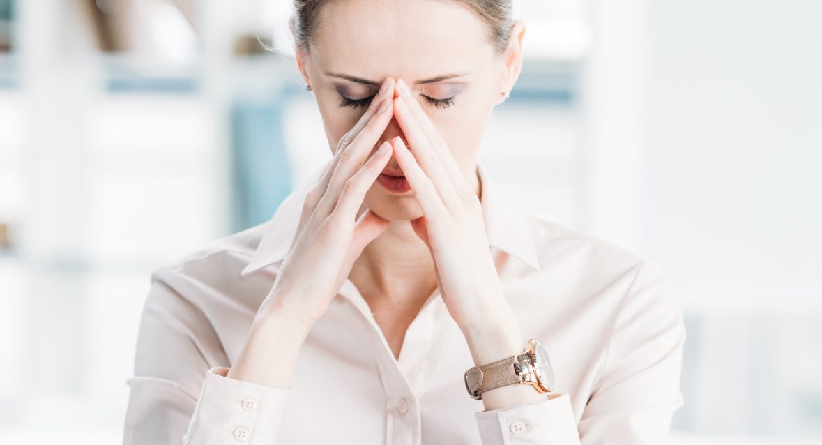 portrait-of-tired-businesswoman-sitting-at-workplace portrait-of-tired-businesswoman-sitting-at-workplace